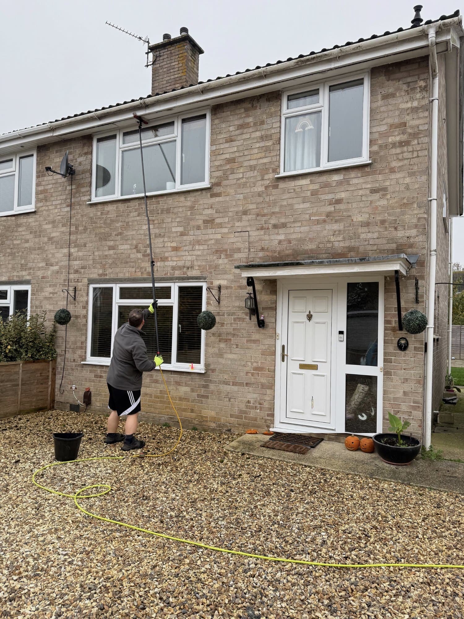 Fascia and soffit cleaning with a water-fed pole