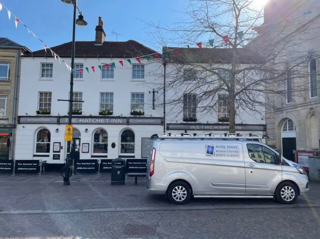 Andy Jones Window Cleaning branded van serving a local town centre
