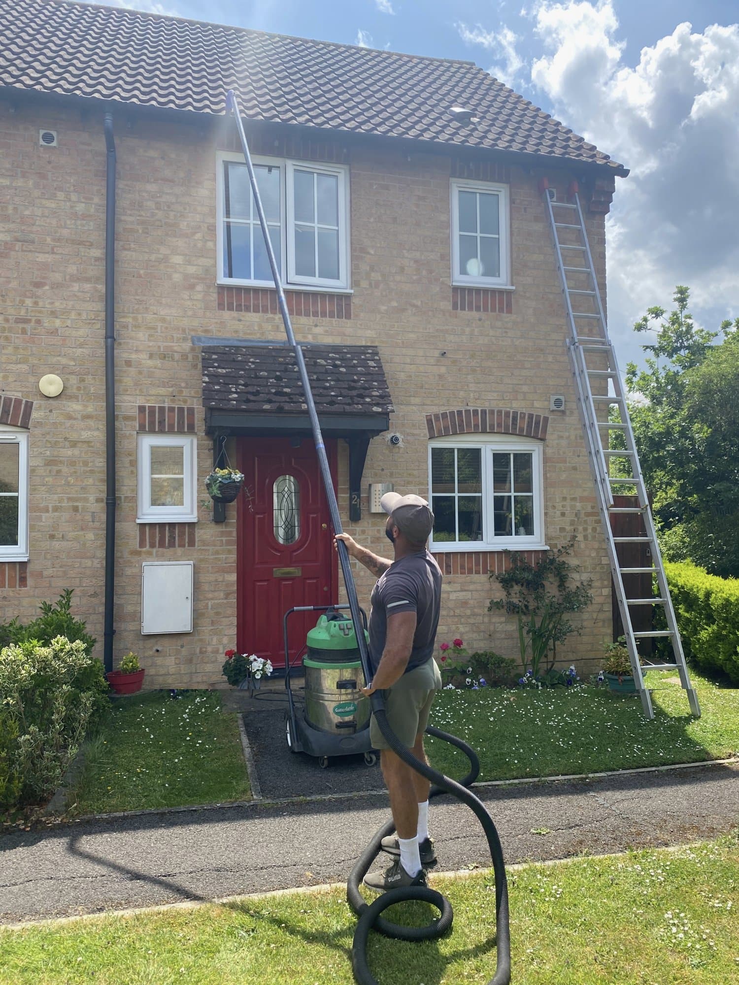Gutter clearance using a high-reach vacuum system
